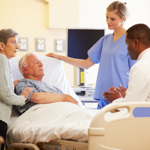 Older Patient and Family member with Doctor and Nurse